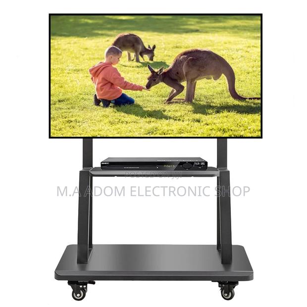 Mobile Tv Stand for Tv Between 32”-75” · Photo 1