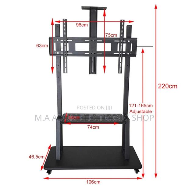 Heavy Duty Floor Standing Tv Stand for TVS Between 32”-100” · Photo 1