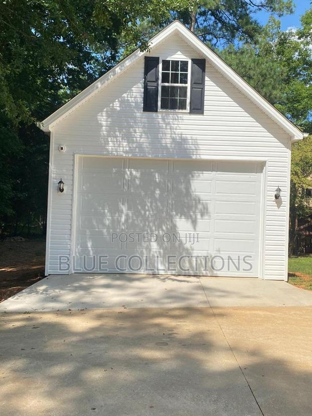 9×8 Automated Garage Door With Remote · Photo 1