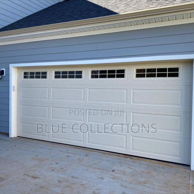 18×8 Garage Doors With Fanlight and Remote · Photo 1