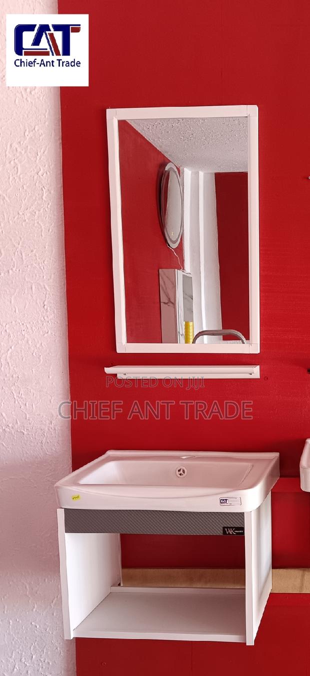Suspended Basin With Mirror and Glass Stand · Photo 1