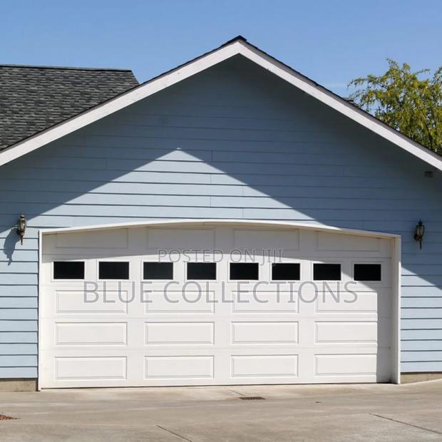 14×8 Automated Garage Door With Fanlight and Two Remote · Photo 1