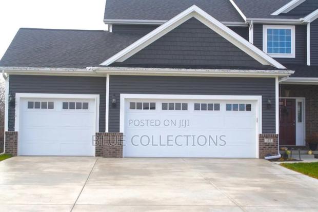 14×8 Automated Garage Door With Fanlight · Photo 1