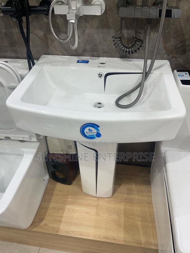 Black and White Water Closet With Wash Hand Basin and Stand · Photo 3