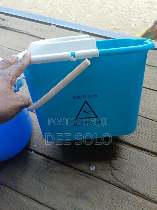 Cleaning Mop Buckets · Photo 1