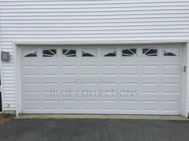 9×8automatic Fanlight Garage Door · Photo 1