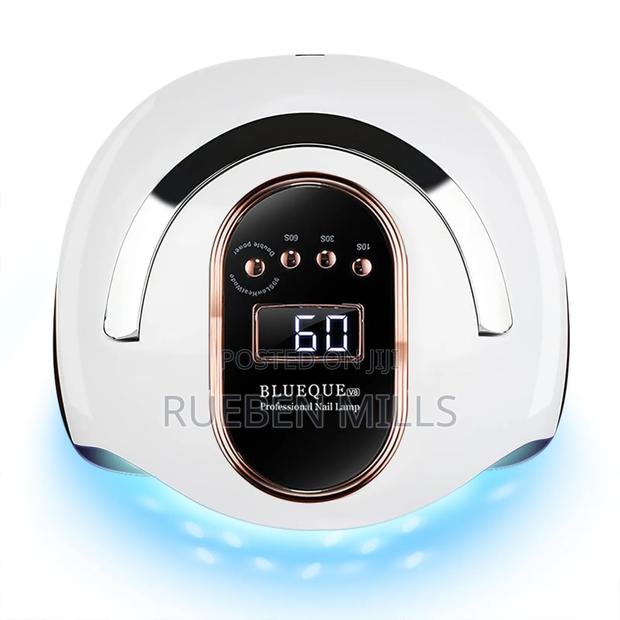 Hands in Lights on Automatic Sensor Professional Nail Dryer · Photo 2