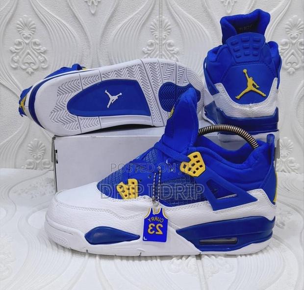Air Jordan 4 Rethro Blue and White With Touches of Yellow · Photo 2
