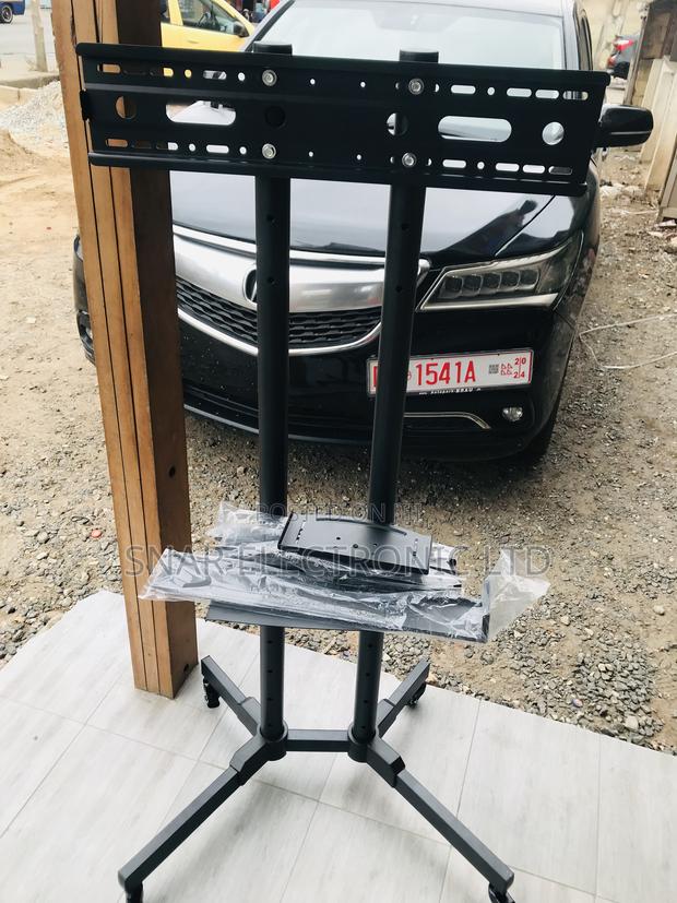 Highly Efficient TV Stand With Wheels Height Adjustable · Photo 1