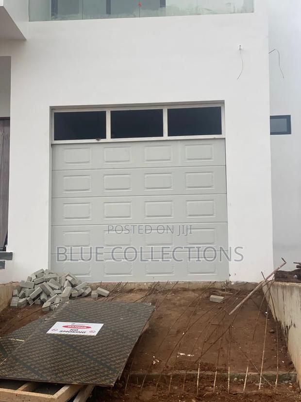 9×8 Automated Garage Door With Fanlight · Photo 1