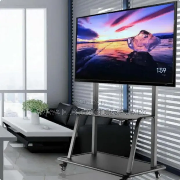 Delightful Movable Tv Stand 32-75 Inches With Wheels and Locks · Photo 1