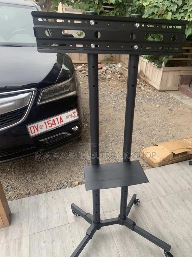 Buy Affordable Mobile Tv Stand With Wheels for 32”-70” Tv. · Photo 1