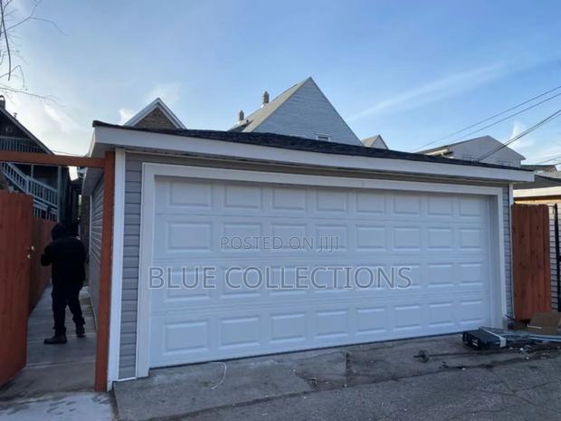 16× 8 Automatic System Garage Door · Photo 1