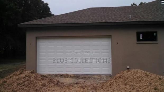 12×8 Automated Garage Door With Remote · Photo 1