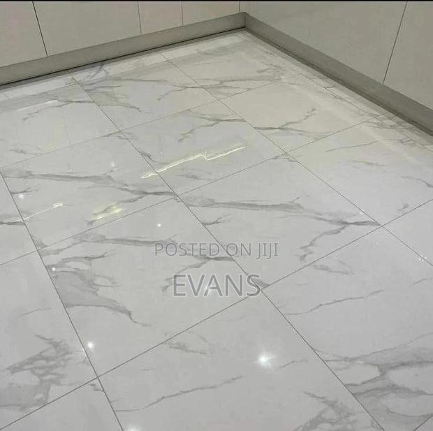 Floor Level Tilling · Photo 1