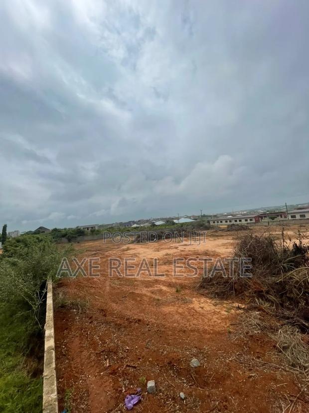Neat Fast Developing Location! Half Plot at Tema Community 25 · Photo 1