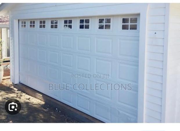 9×8 Garage Door With Fanlight and Remote · Photo 1