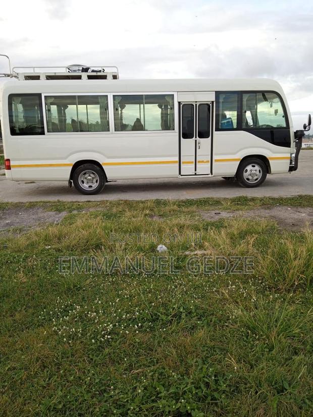 Coaster Bus Rental - New Type (30 Seater) · Photo 1