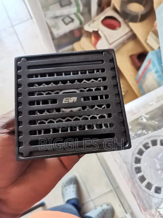 Black Metal Floor Drain · Photo 1