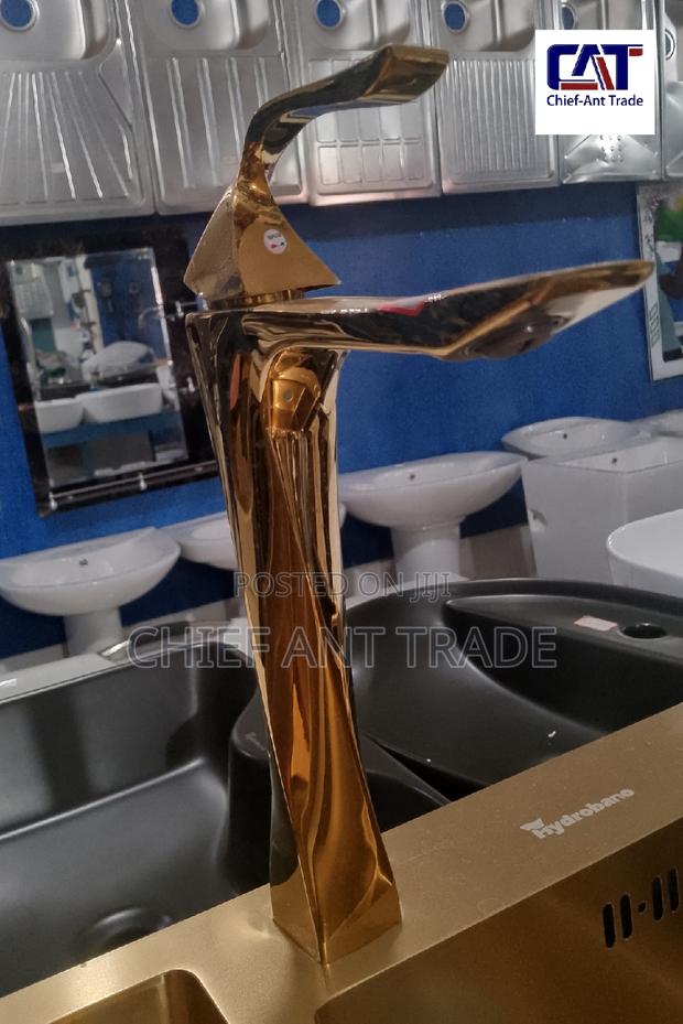 Tall Golden Faucet · Photo 1