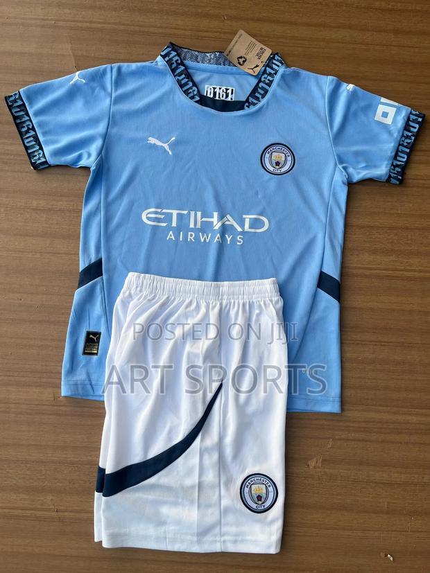 24 / 25 Manchester City Home Kids Jersey · Photo 1