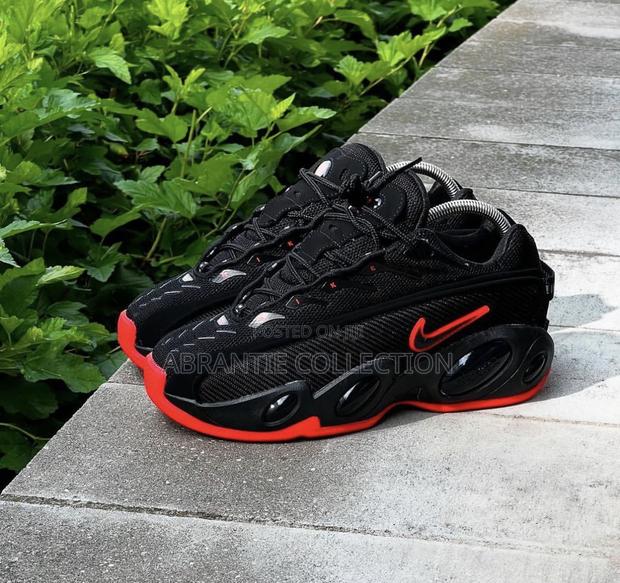 Nike Nocta Glide Black/Red · Photo 1