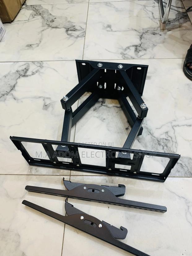 Adjustable Tv Wall Mount for a Solid View 33”-80” · Photo 1