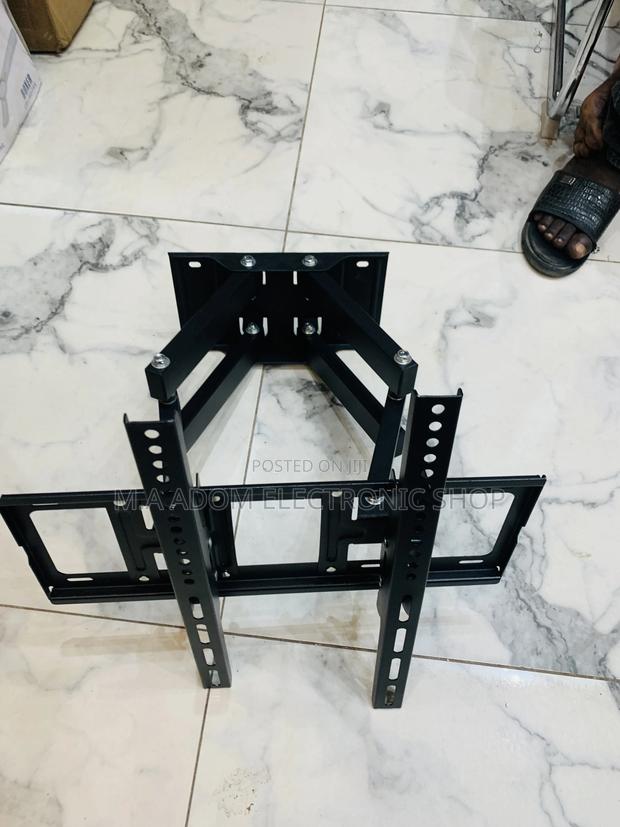 Adjustable Tv Wall Mount for a Solid View 33”-80” · Photo 2