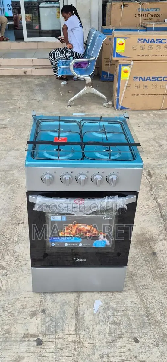 Cook Fast Midea 50 by 50 4 Burners and Oven · Photo 1