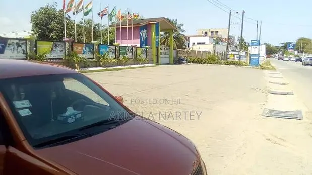 Titled One and Half Acre Roadside Land at East Legon · Photo 1