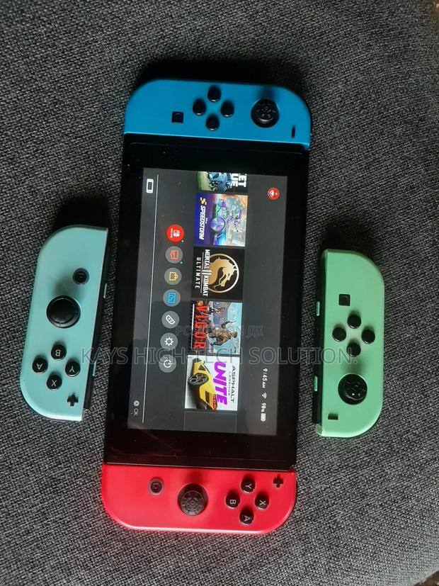 Nintendo Switch With Mk 1 Other Games and Accessories · Photo 1