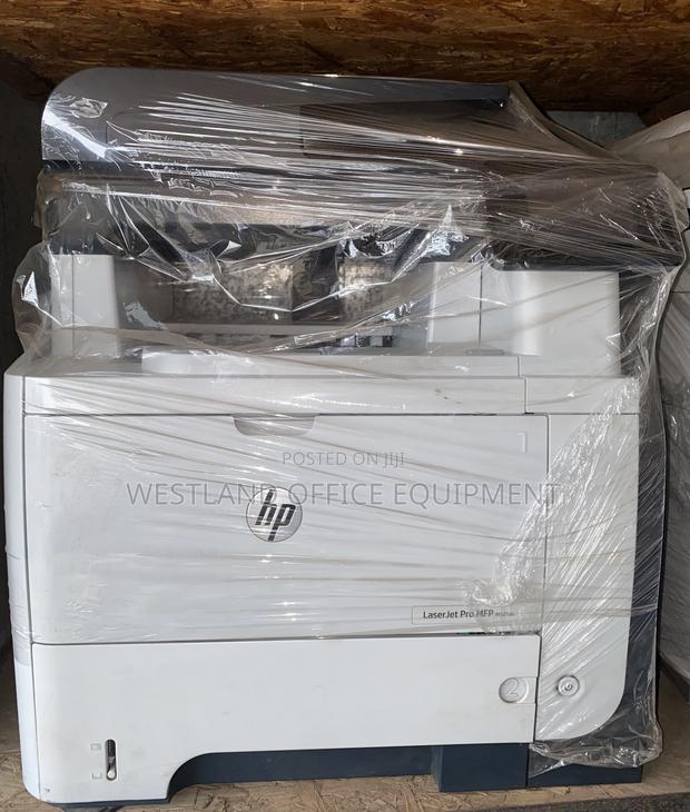 HP Laserjet PRO MFP M521dn · Photo 1