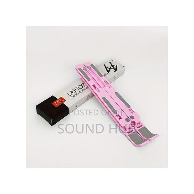 Portable Adjustable Laptop Stand - Ergonomic and Foldable · Photo 1