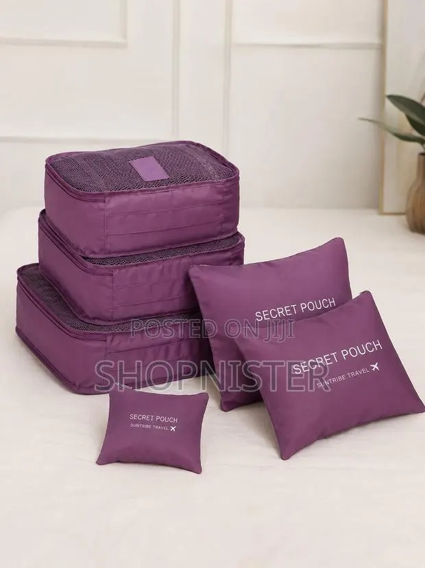 Packing Essentials on a Minimalist Bed · Photo 1