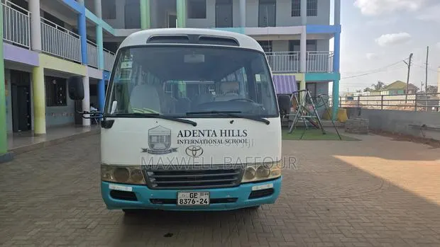 Toyota Coaster 2009 White · Photo 1