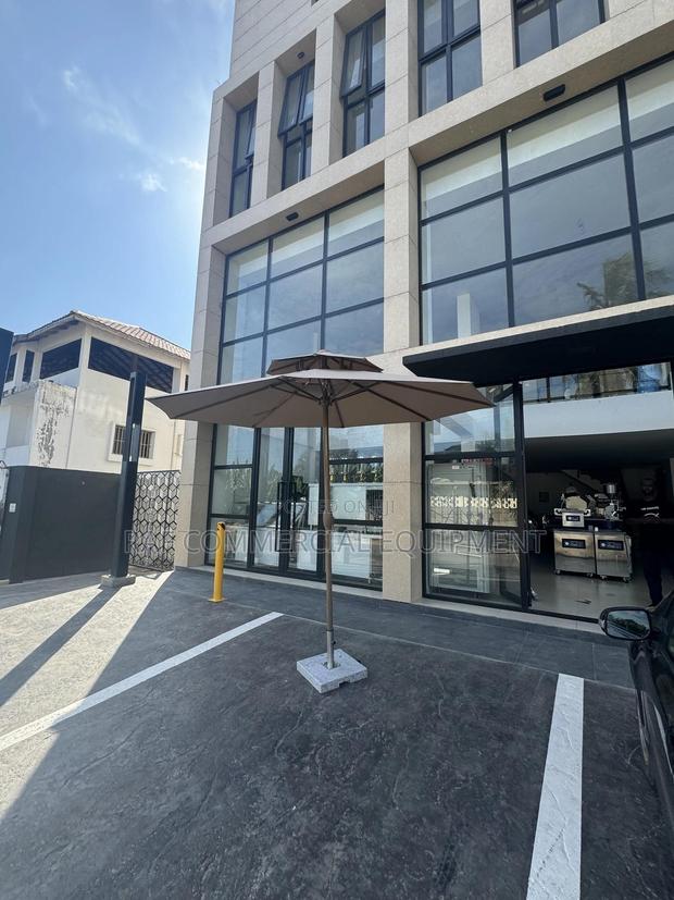 Beach Umbrella With Stone · Photo 1