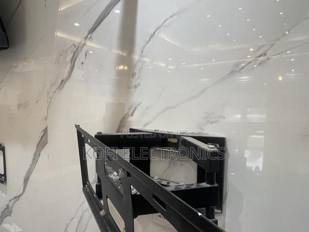 Installation Friendly Swivel TV Mount for 40''- 80” · Photo 1