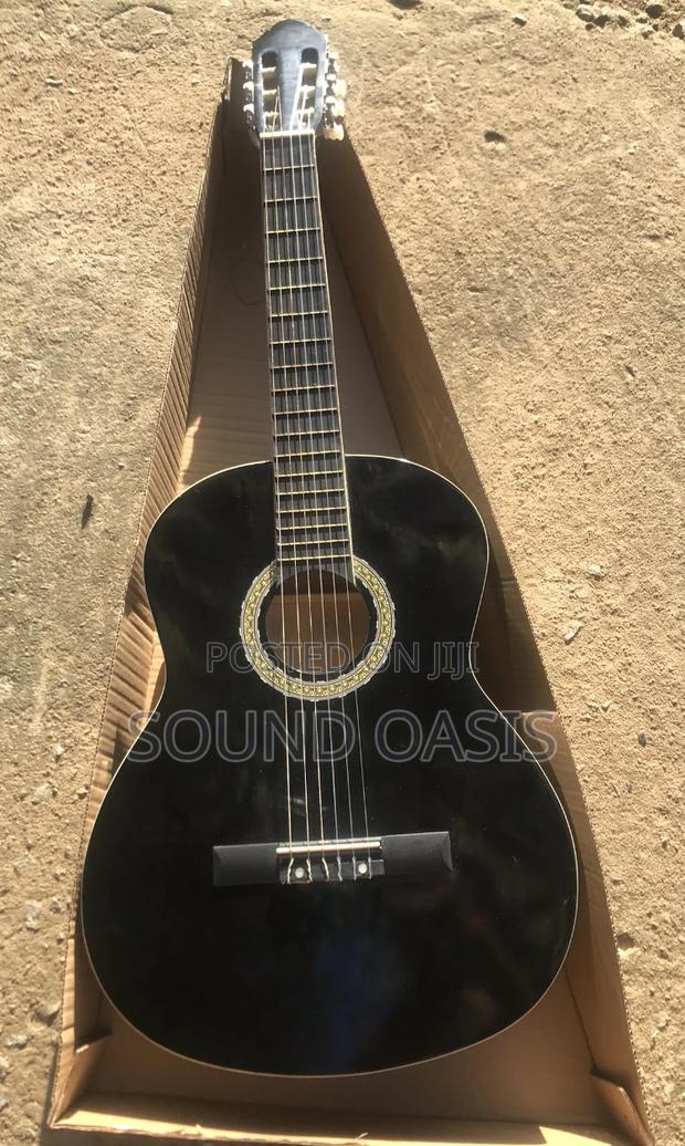 Black Acoustic Guitar · Photo 1