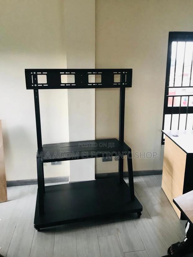 Heavy-Duty Mobile TV Stand - Sturdy and Stylish · Photo 1