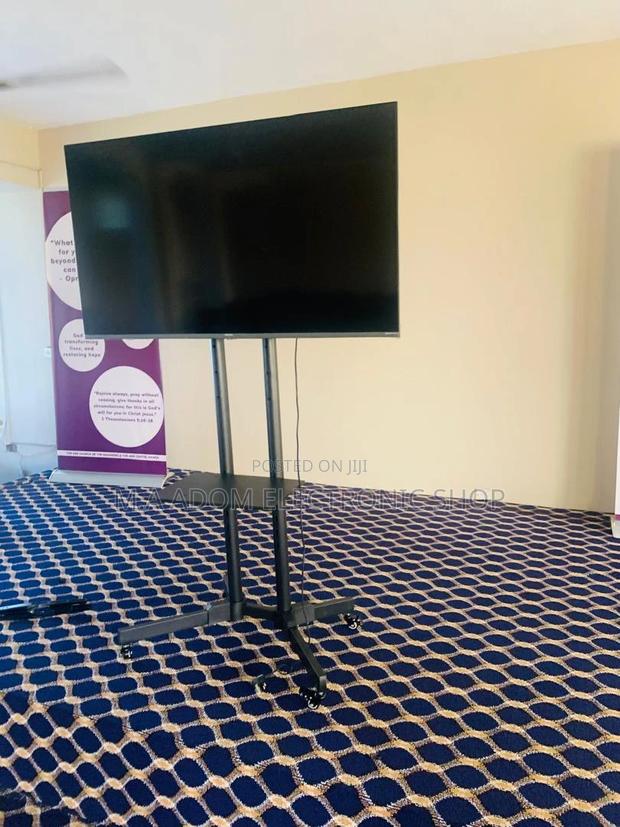 Sleek and Functional: Mobile TV Stand for 32”-70" TVS · Photo 1