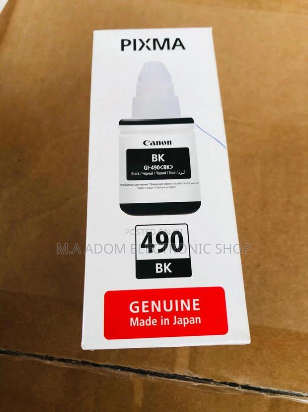 Canon GI-590 Ink Bottles: Cost-Effective Printing Solution · Photo 1