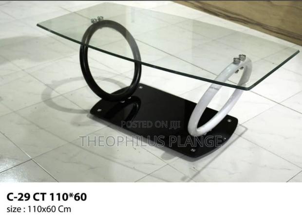 Glass Center Table With Ring Stand Design · Photo 1