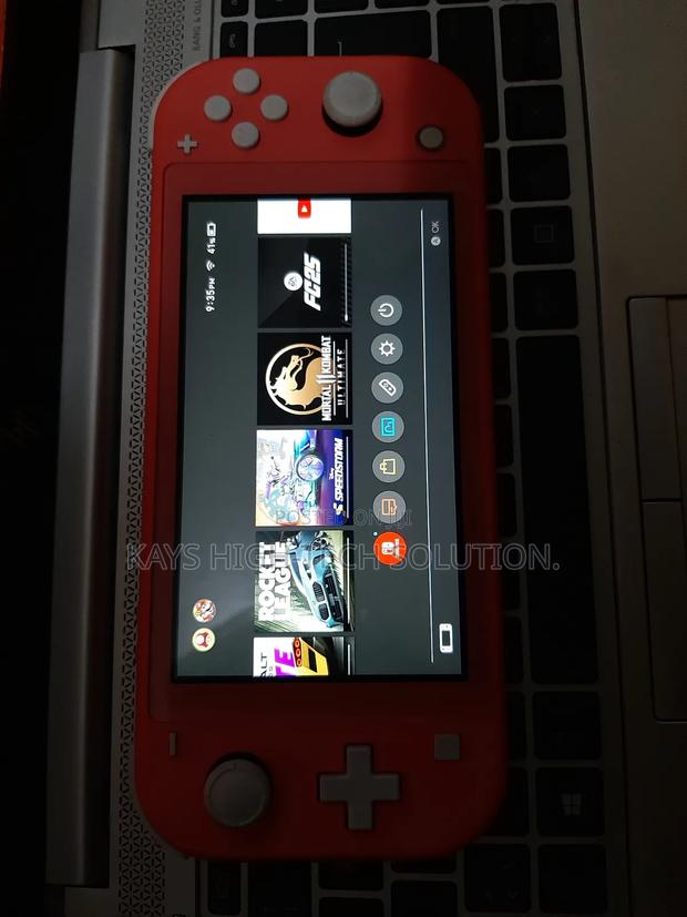 Nintendo Switch Lite With Fc 25, Mk 11 Other Games · Photo 1