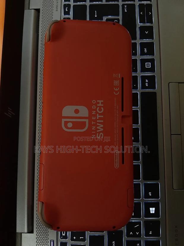 Nintendo Switch Lite With Fc 25, Mk 11 Other Games · Photo 2