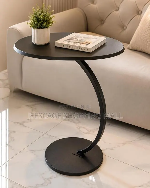 Modern Matte Black Round Side Table With Curved Base · Photo 1