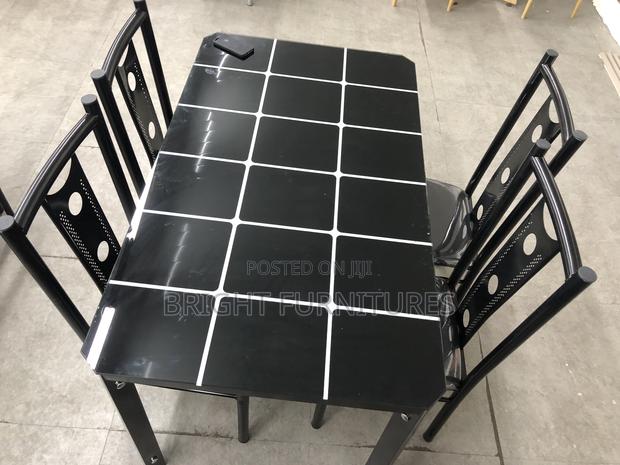 Dining Table With Four Chairs · Photo 1