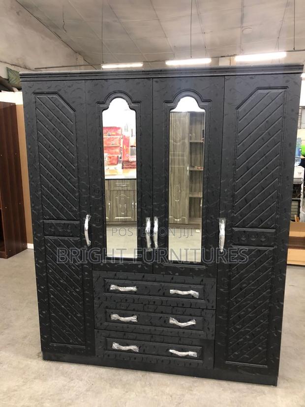 Foreign Four Doors Wardrobe With Mirror and Drowners · Photo 1