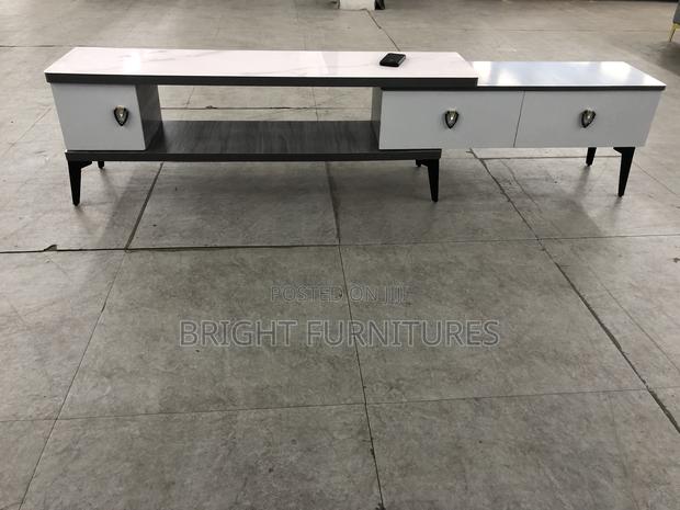 Foreign TV Stand With Drowners · Photo 1