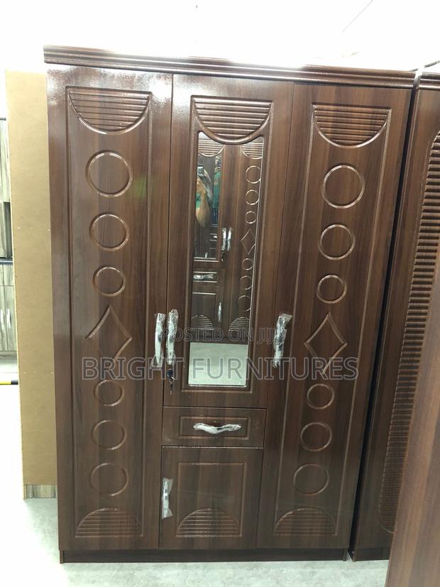 Foreign Three (3) Door Wardrobe With Mirror and Drowners · Photo 1