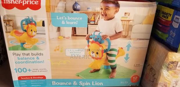 Fisher-Price Bounce Spin Lion Stationary Ride-On, 12m+ · Photo 2